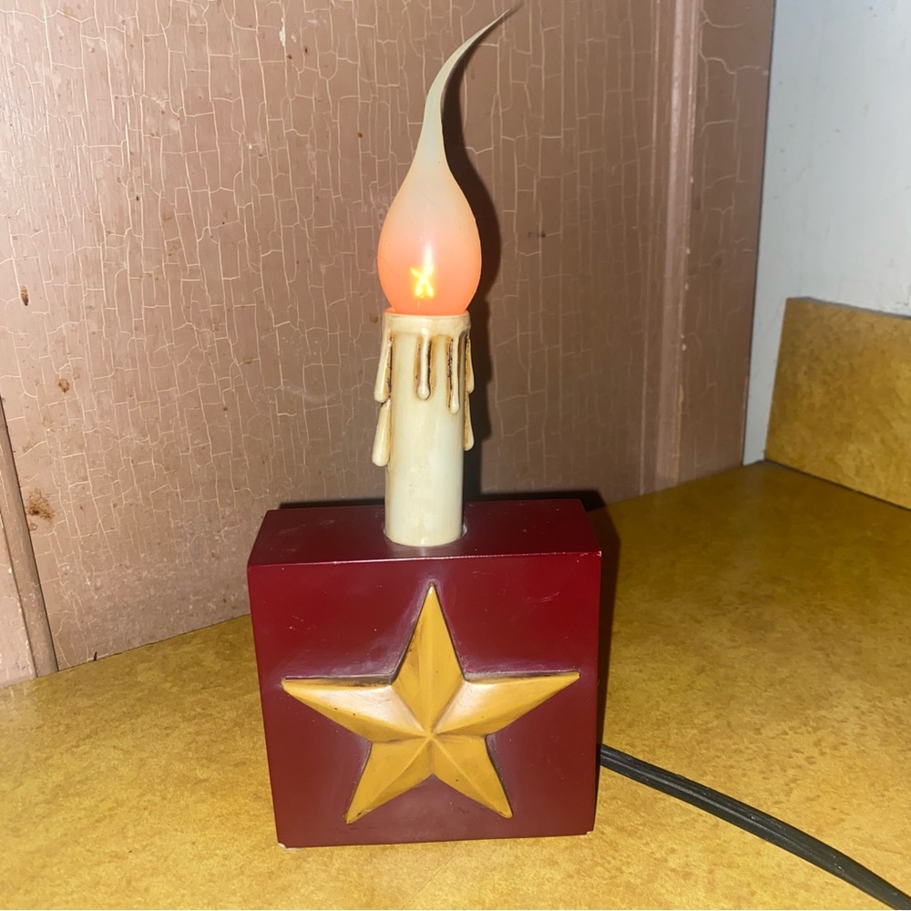 Primitive Star ⭐️ electric decor.  Maroon with gold Star.